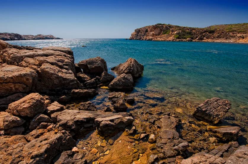 Rocky shore and clear water of Aquarium Bay on Bozcaada island
