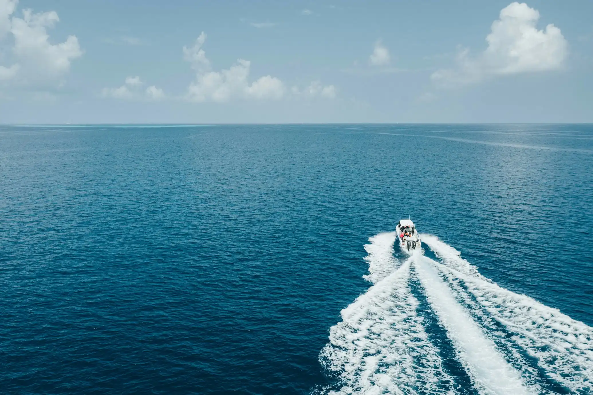 Boat on the open blue sea